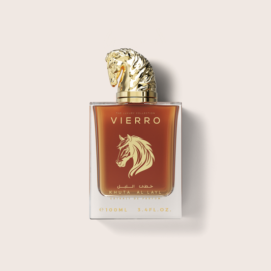 A 100ml bottle of Khuta Al-Layl Eau de Parfum by Vierro, featuring a clear glass bottle with amber-brown liquid, a gold horse head logo, and a sculpted gold horse head cap, set against a light beige background.