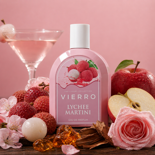 Viero Lychee Martini perfume bottle with lychees, apples, and a cocktail on a pink background