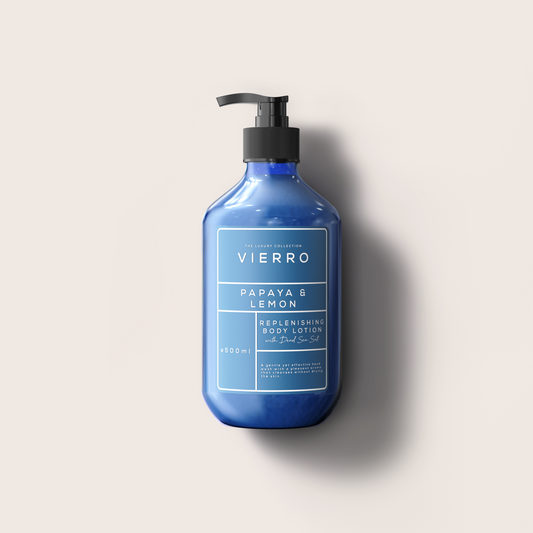 Blue bottle of Vierro Papaya & Lemon replenishing body lotion on a light background