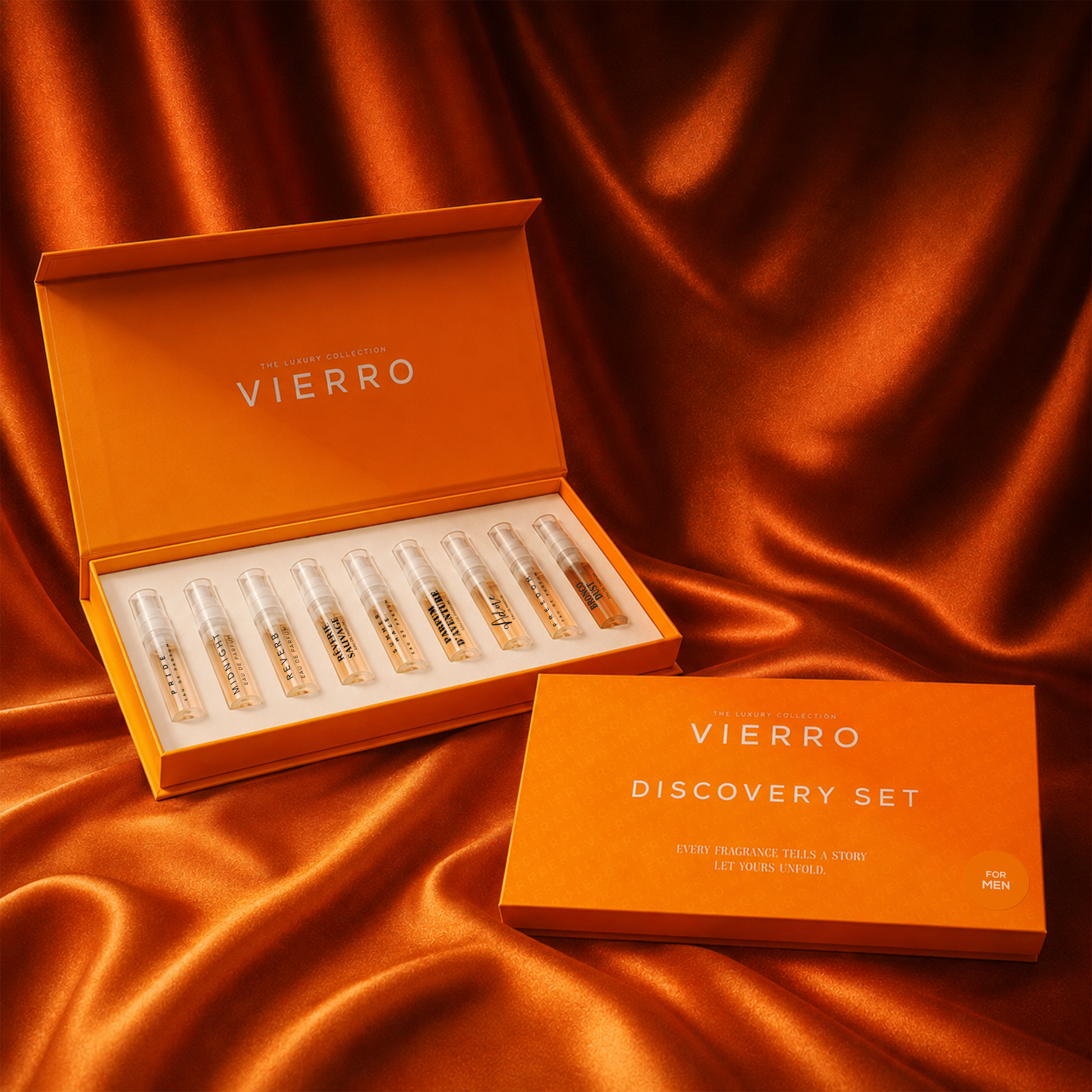 Vierro Discovery Set for men fragrance sample vials presented in an open orange box, with a matching closed box beside it on a draped orange satin fabric background.